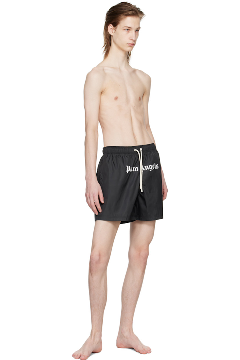 Polyester taffeta swim shorts. 

· Drawstring at elastisized waistband 
· Three-pocket styling
· Logo printed at front
· Eyelet at back
· Partial mesh lining

Supplier color: Black/White