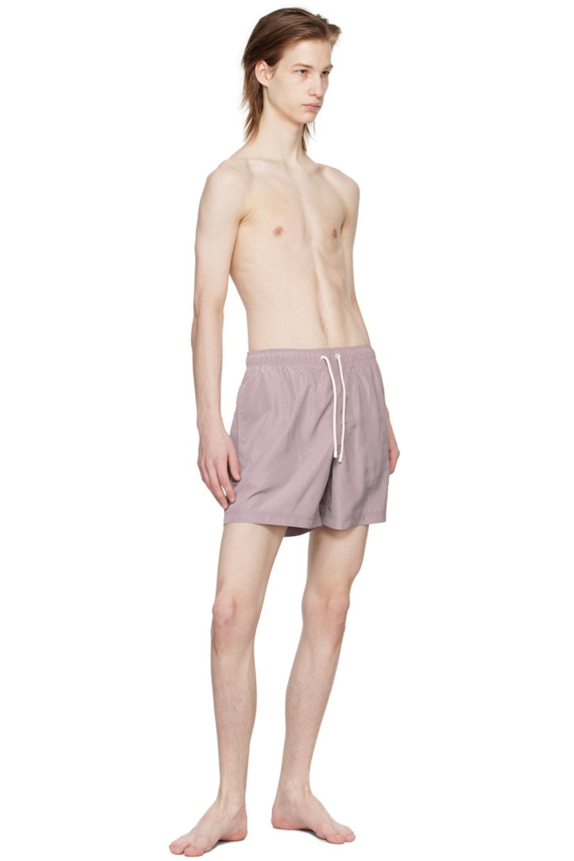 Polyester taffeta swim shorts. 

· Drawstring at elastisized waistband 
· Three-pocket styling
· Logo embroidered at leg
· Eyelet and logo flag at back
· Partial mesh lining

Supplier color: Lilac/Lilac