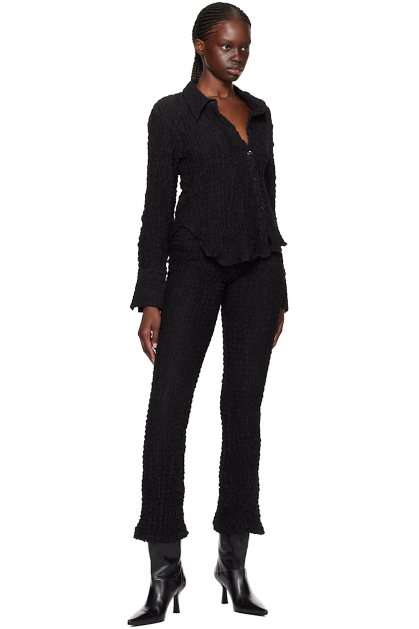 Flared textured stretch cotton-blend jersey leggings. Elasticized waistband.

Supplier color: Black