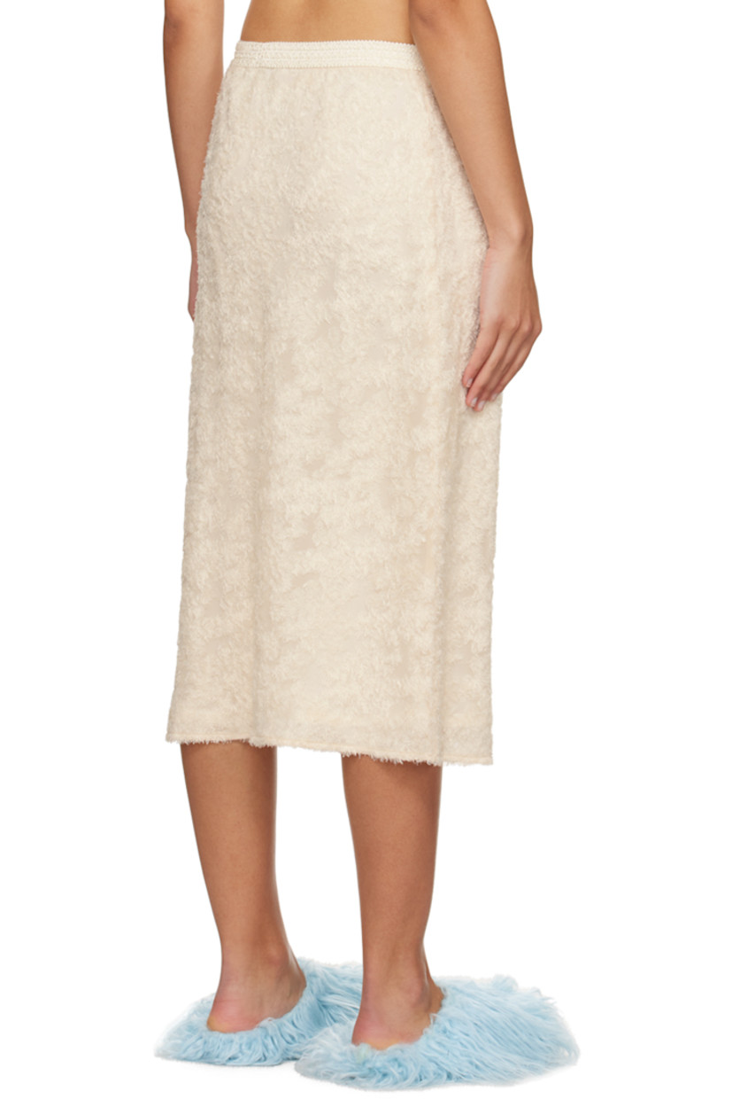 Plain-woven polyester- and cupro-blend skirt. Graphic pattern flocked throughout.

· Elasticized waistband
· Full cupro satin lining

Supplier color: White