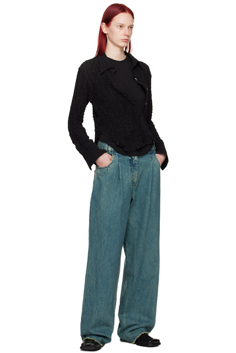 Rib knit stretch cotton tank top.

· Crewneck
· Raw edge at shirttail hem
· Central seam at back
 
Supplier color: Black