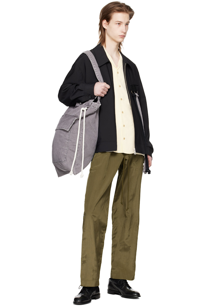 Stonewashed non-stretch denim tote in gray. 

· Distressing and subtle fading throughout
· Twin shoulder straps
· Cord accent at face
· Flap pocket 
· Logo flag at side
· Open throat
· Patch pocket at interior
· Full flannel lining 
· Contrast stitching in black
· H20.5" x W16.75" 

Supplier color: Dark grey