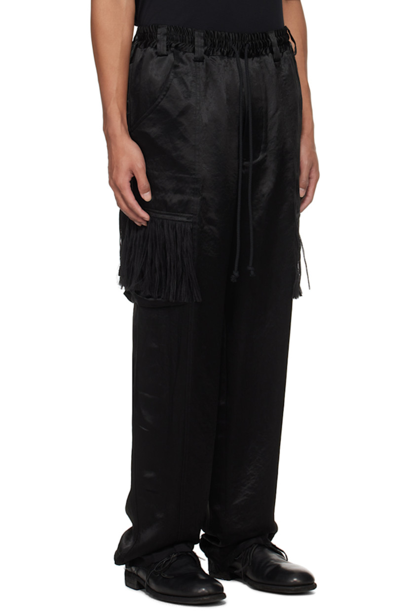 Acetate satin cargo pants.

· Belt loops 
· Drawstring at elasticized waistband
· Four-pocket styling
· Button-fly
· Cargo pockets at outseams
· Fringe detailing at cargo pockets
· Raw edge at cuffs
· Full twill lining

Supplier color: Black