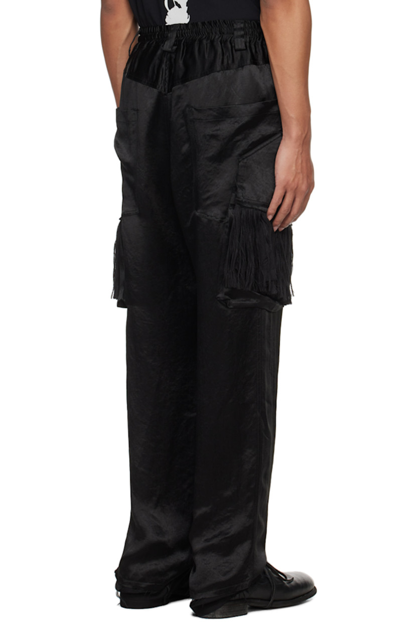 Acetate satin cargo pants.

· Belt loops 
· Drawstring at elasticized waistband
· Four-pocket styling
· Button-fly
· Cargo pockets at outseams
· Fringe detailing at cargo pockets
· Raw edge at cuffs
· Full twill lining

Supplier color: Black