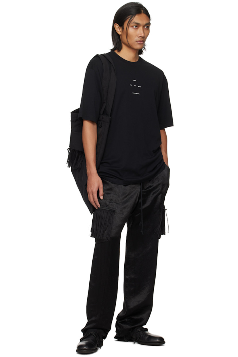 Acetate satin cargo pants.

· Belt loops 
· Drawstring at elasticized waistband
· Four-pocket styling
· Button-fly
· Cargo pockets at outseams
· Fringe detailing at cargo pockets
· Raw edge at cuffs
· Full twill lining

Supplier color: Black
