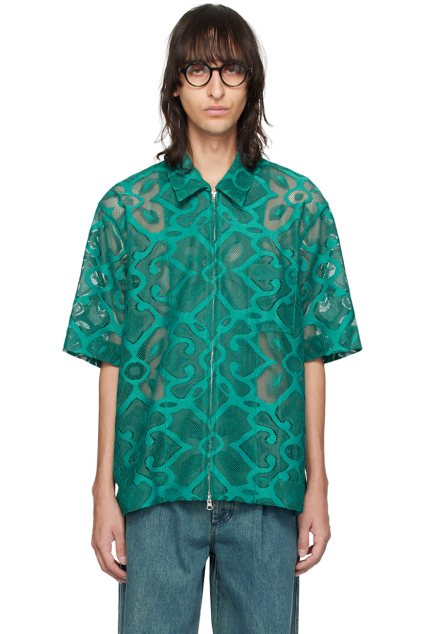 Semi-sheer polyester lace shirt. Graphic pattern embroidered throughout.

· Spread collar
· Two-way zip closure
· Patch pocket at chest
· Vented side seams
· Dropped shoulders

Supplier color: Peacock