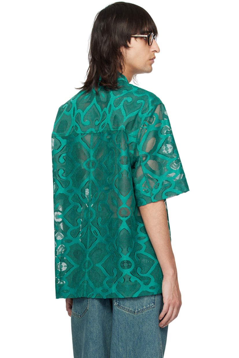 Semi-sheer polyester lace shirt. Graphic pattern embroidered throughout.

· Spread collar
· Two-way zip closure
· Patch pocket at chest
· Vented side seams
· Dropped shoulders

Supplier color: Peacock