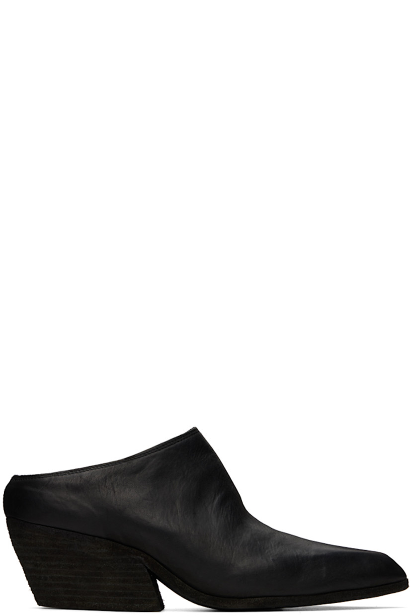 Handcrafted grained horse leather mules in black.

· Pointed toe
· Logo embossed at padded leather footbed
· Stacked leather heel 
· Leather sole
· Heel: H2.25"

Supplier color: Black