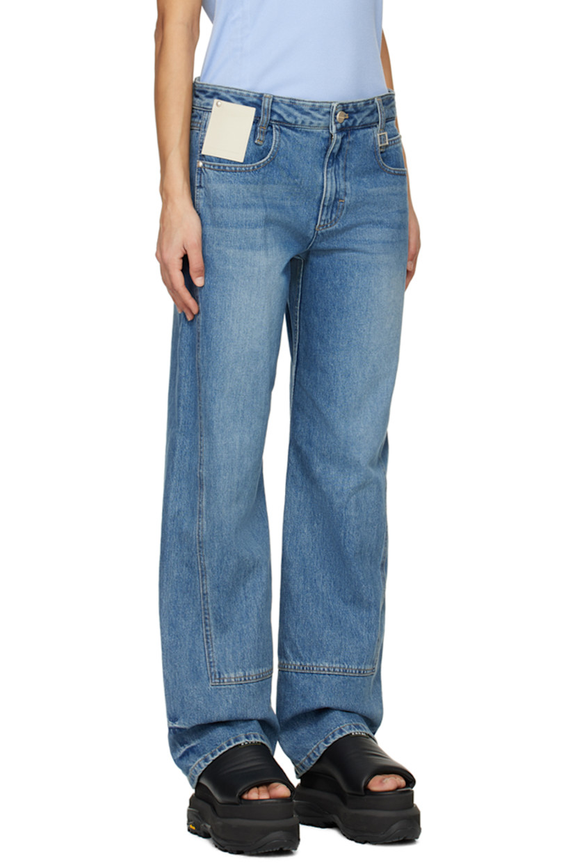Straight-leg non-stretch denim jeans. Fading and whiskering throughout.

· Paneled construction
· Belt loops
· Logo hardware at waist
· Five-pocket styling
· Zip-fly
· Logo patch at front pocket and back waist
· Contrasting stitching in tan
· Logo-engraved silver-tone hardware

Supplier color: Blue