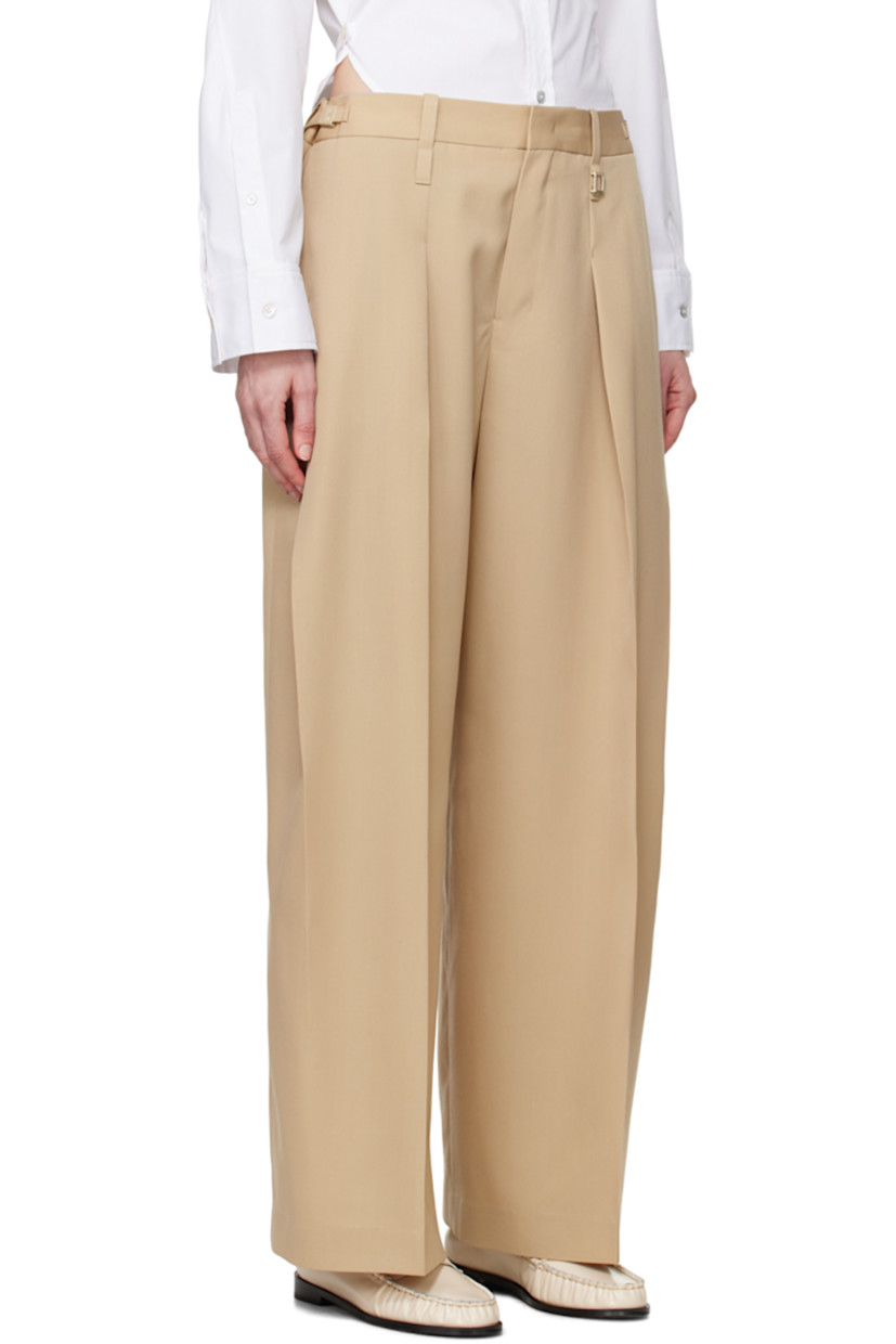 Wool delaine trousers. 

· Belt loops
· Logo hardware and cinch tabs at waistband
· Four-pocket styling
· Zip-fly
· Pleats at front

Supplier color: Beige
