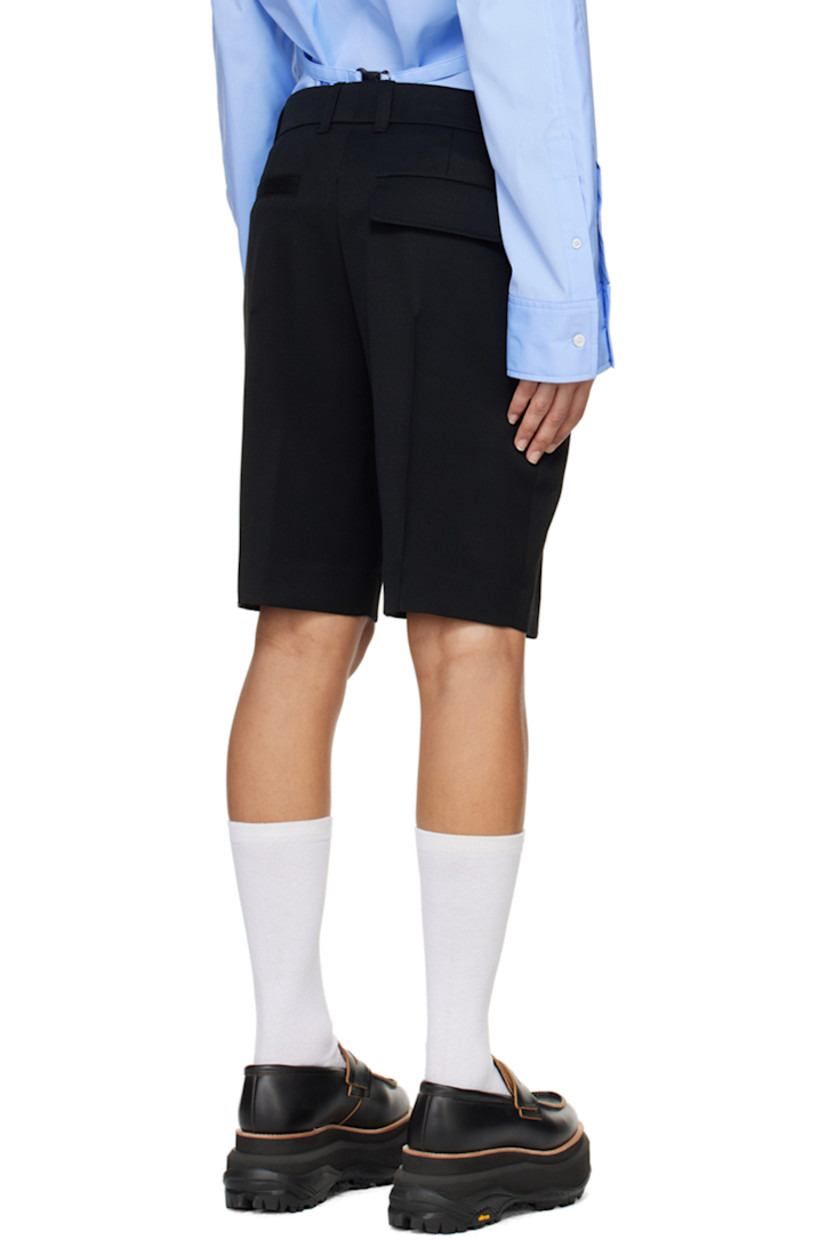 Wool twill shorts.

· Belt loops
· Logo hardware at front and back waist
· Five-pocket styling
· Zip-fly
· Creased legs

Supplier color: Black