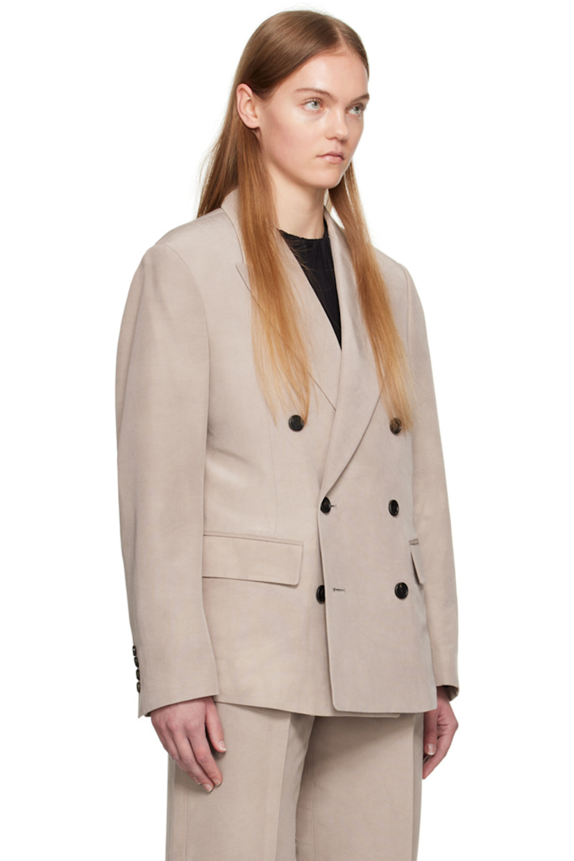Hand-dyed cotton- and silk-blend faille blazer.

· Peaked lapel
· Double-breasted button closure
· Welt pocket and flap pockets
· Padded shoulders
· Four-button surgeon's cuffs
· Central vent at back hem
· Welt pockets at interior
· Partial satin lining

Supplier color: Beige