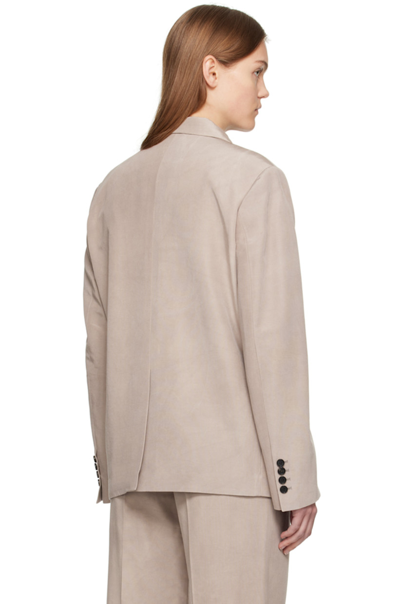 Hand-dyed cotton- and silk-blend faille blazer.

· Peaked lapel
· Double-breasted button closure
· Welt pocket and flap pockets
· Padded shoulders
· Four-button surgeon's cuffs
· Central vent at back hem
· Welt pockets at interior
· Partial satin lining

Supplier color: Beige