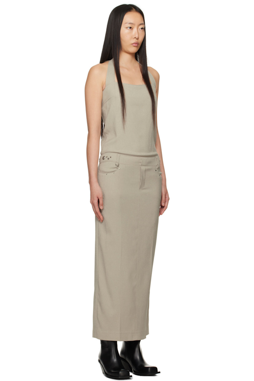 Stretch polyester canvas dress.

· Square neck
· Graphic hardware at front and side seams
· Belt loops and D-ring hardware at waist
· Welt pockets
· Mock-fly
· Self-tie halter straps
· Concealed zip closure at side seam
· Central vent at back hem
· Full poplin lining

Supplier color: Beige