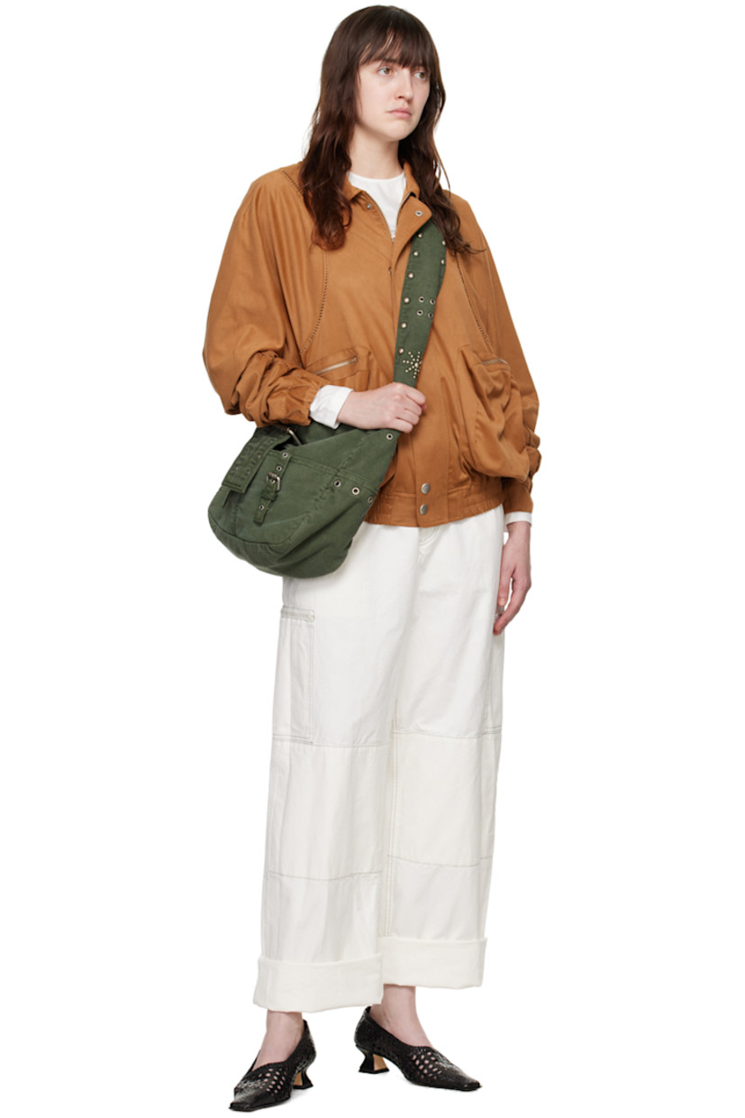 Faux-suede bomber jacket. Embroidered detailing throughout.

· Spread collar
· Two-way zip closure with press-stud placket
· Zip pockets
· Elasticized hem and cuffs
· Yoke sleeves
· Locker loop at back yoke
· Logo embroidered at back
· Full satin lining
· Logo-engraved silver-tone hardware

Supplier color: Brown