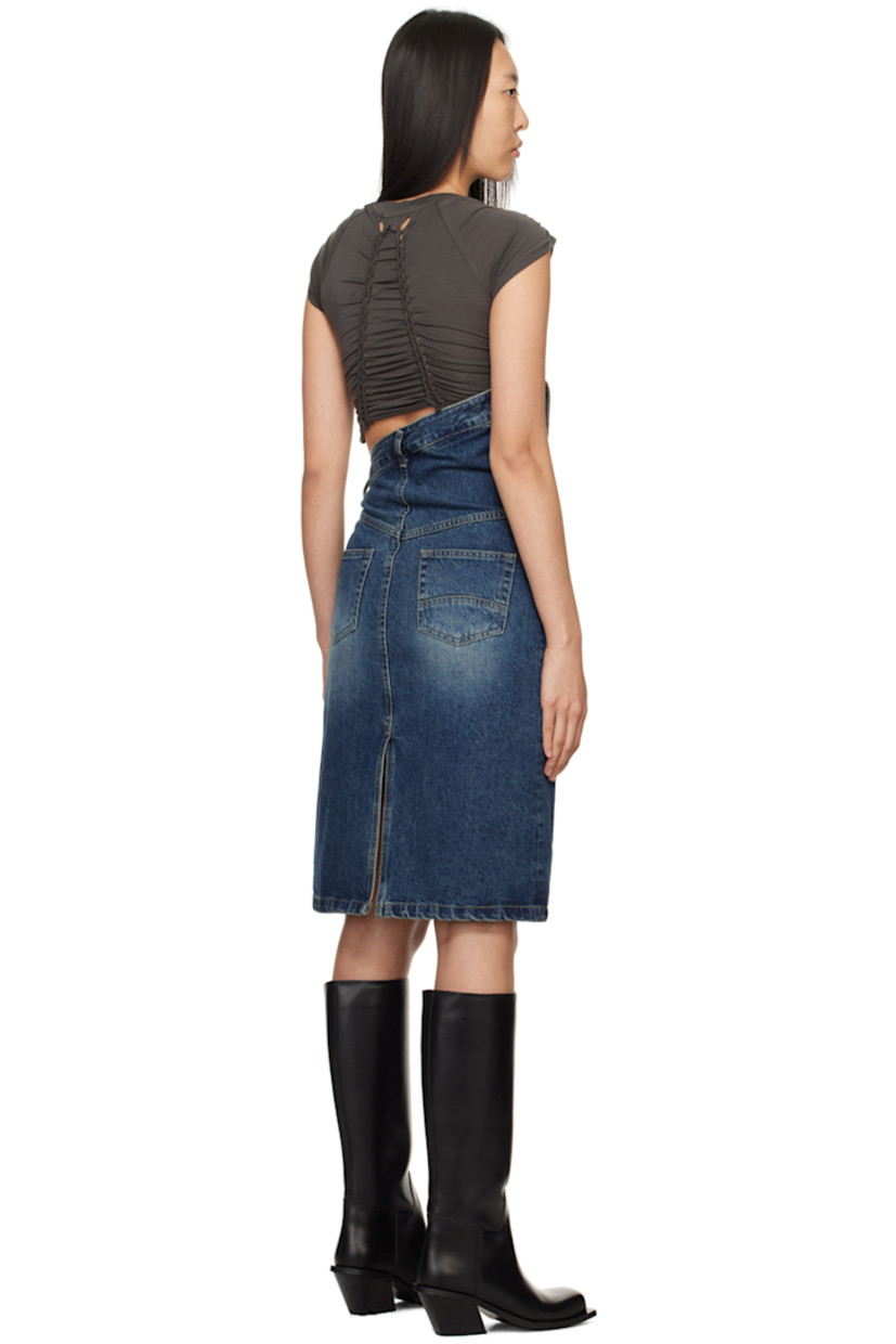 Non-stretch denim skirt. Fading throughout.

· Asymmetrical construction
· Belt loops at folded waistband
· Three-pocket styling
· Adjustable button fastenings at zip-fly for alternate styling
· Leather logo patch at back waistband
· Central vent at back hem
· Logo-engraved silver-tone hardware

Supplier color: Blue
