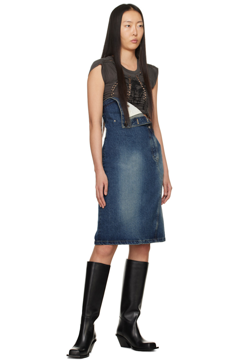 Non-stretch denim skirt. Fading throughout.

· Asymmetrical construction
· Belt loops at folded waistband
· Three-pocket styling
· Adjustable button fastenings at zip-fly for alternate styling
· Leather logo patch at back waistband
· Central vent at back hem
· Logo-engraved silver-tone hardware

Supplier color: Blue