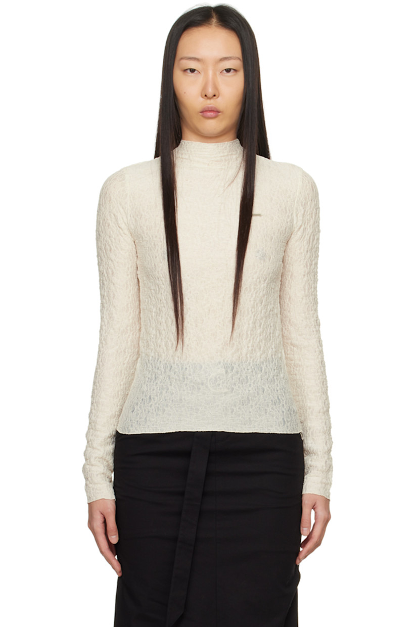 Semi-sheer stretch polyester T-shirt. Shirring throughout. 

· Mock neck 
· Logo plaque at chest 
· Lettuce edge hem and cuffs 
· Button closure at back 

Supplier color: Ivory