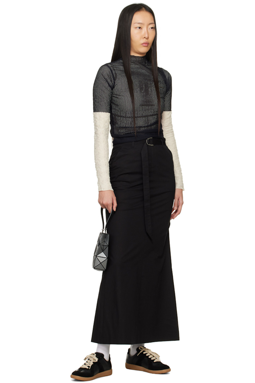 Semi-sheer stretch polyester T-shirt. Shirring throughout. 

· Mock neck 
· Logo plaque at chest 
· Lettuce edge hem and cuffs 
· Button closure at back 

Supplier color: Ivory