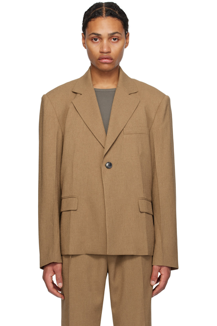Stretch polyester twill blazer.

· Notched lapel
· Single-button closure
· Welt pocket and flap pockets
· Padded shoulders
· Creased sleeves
· Locker loop at back collar
· Central vent at back hem
· Full satin lining

Supplier color: Camel