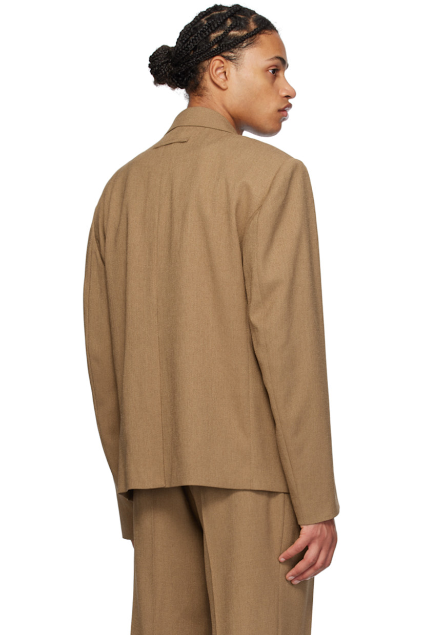 Stretch polyester twill blazer.

· Notched lapel
· Single-button closure
· Welt pocket and flap pockets
· Padded shoulders
· Creased sleeves
· Locker loop at back collar
· Central vent at back hem
· Full satin lining

Supplier color: Camel