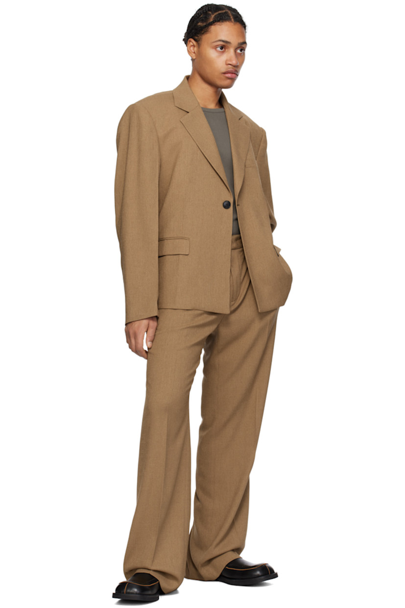 Stretch polyester twill blazer.

· Notched lapel
· Single-button closure
· Welt pocket and flap pockets
· Padded shoulders
· Creased sleeves
· Locker loop at back collar
· Central vent at back hem
· Full satin lining

Supplier color: Camel