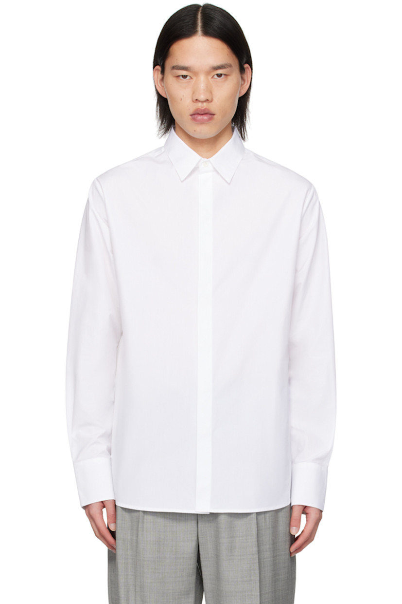 Cotton poplin shirt. 

· Spread collar
· Button closure
· Shirttail hem
· Single-button barrel cuffs
· Box pleat at back yoke 

Supplier color: White