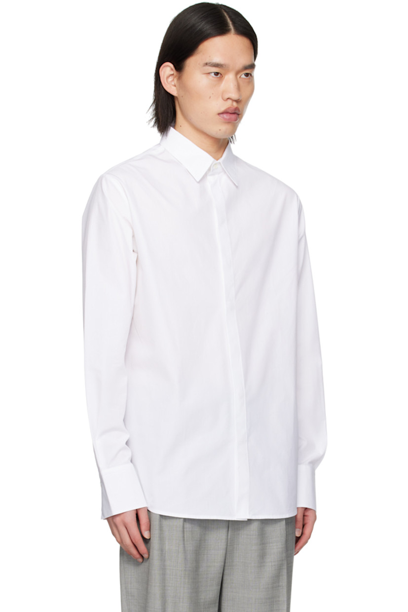 Cotton poplin shirt. 

· Spread collar
· Button closure
· Shirttail hem
· Single-button barrel cuffs
· Box pleat at back yoke 

Supplier color: White