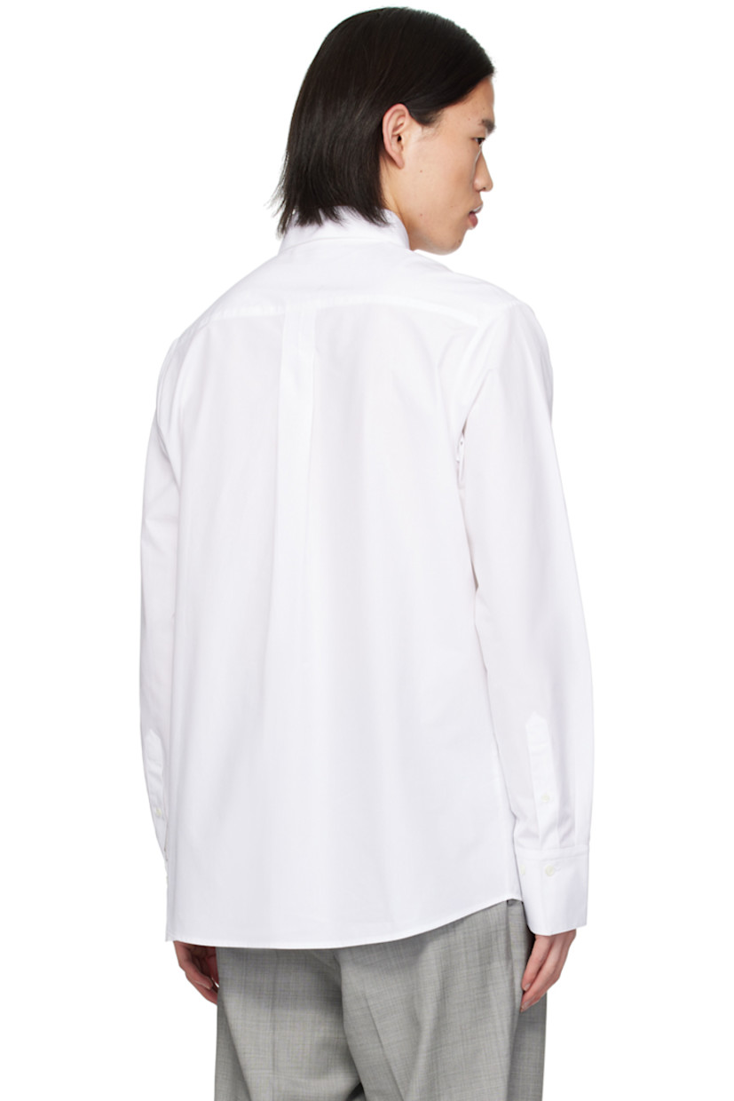 Cotton poplin shirt. 

· Spread collar
· Button closure
· Shirttail hem
· Single-button barrel cuffs
· Box pleat at back yoke 

Supplier color: White