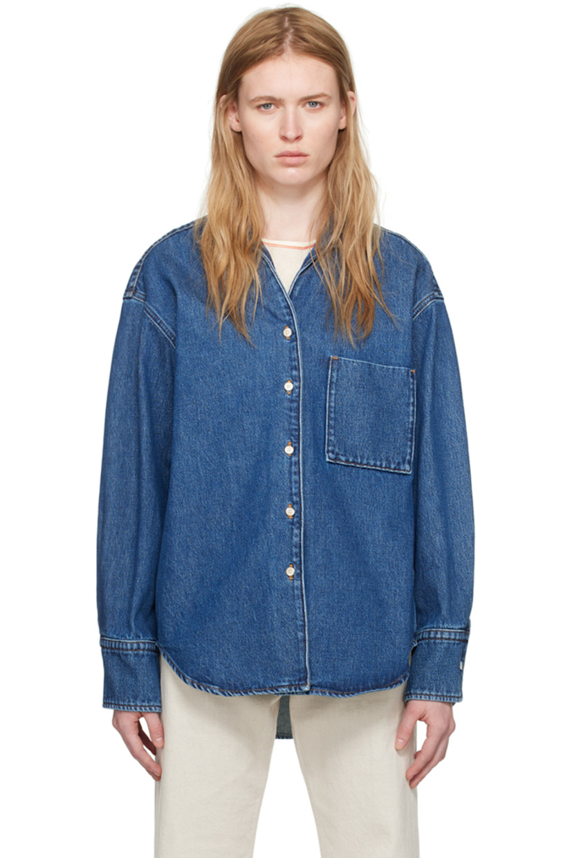 Non-stretch organic cotton denim shirt. 

· Open spread collar
· Button closure
· Patch pocket 
· Shirttail hem
· Single-button barrel cuffs
· Inverted box pleats at back yoke
· Contrast stitching in orange

Supplier color: Mid blue