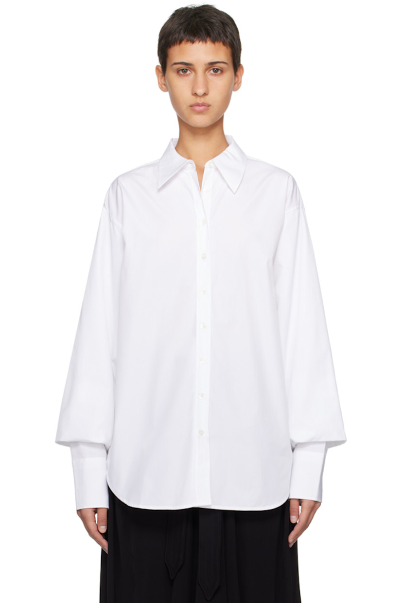 Cotton poplin shirt.

· Pointed collar
· Button closure
· Shirttail hem
· Gathering at bishop sleeves
· Single-button barrel cuffs

Supplier color: White