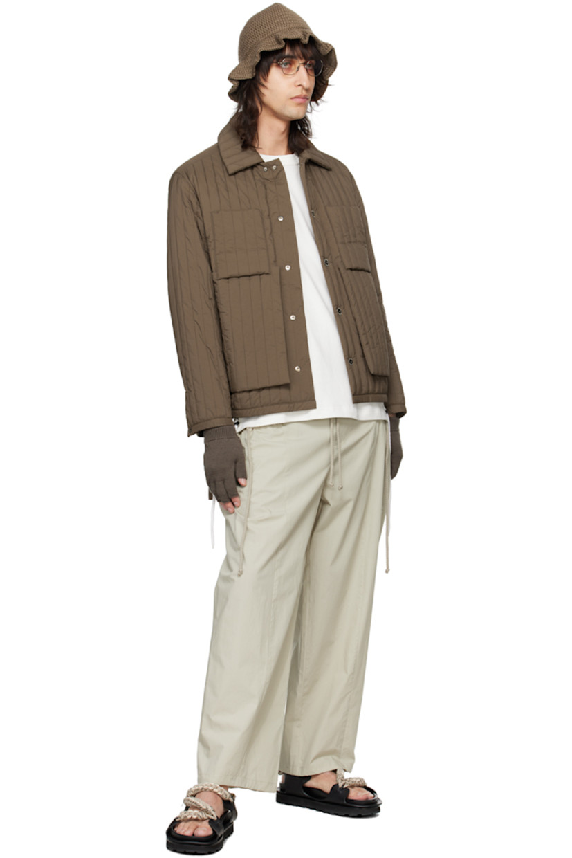 Cotton poplin trousers.

· Drawstring at elasticized waistband 
· Two-pocket styling
· Drawstring at pockets and cuffs
· Logo embroidered at front 

Supplier color: Beige