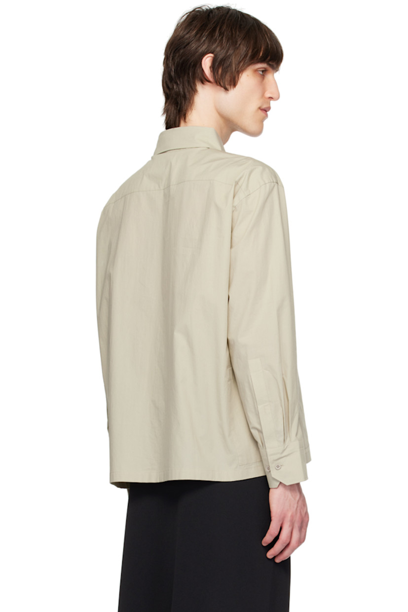 Cotton poplin shirt.

· Spread collar
· Button closure
· Graphic embroidered at chest
· Patch pocket at side seams
· Single-button barrel cuffs

Supplier color: Beige