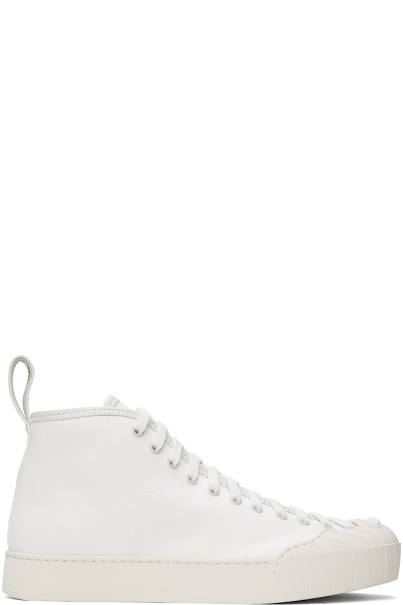 High-top cotton canvas sneakers in white.

· Buffed calfskin trim throughout
· Textured rubber cap toe
· Lace-up closure
· Eyelets at inner side
· Grosgrain pull-loop at heel tab
· Unlined
· Treaded rubber sole

Supplier color: White