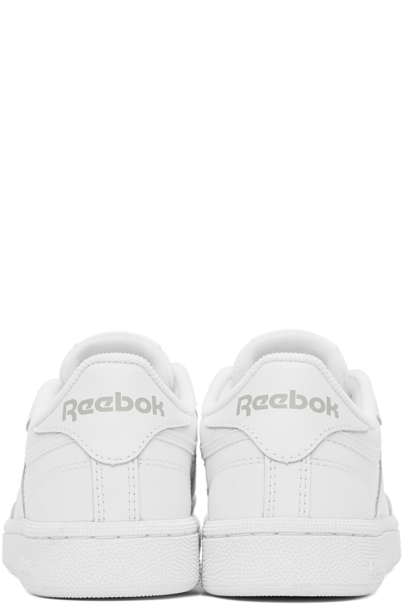 Low-top buffed leather sneakers in white.

· Perforated detailing at toe
· Lace-up closure
· Logo patch at padded tongue
· Padded collar
· Inset logo patch at outer side
· Logo printed at heel counter
· Terrycloth lining
· Treaded rubber sole

Supplier color: White/Light grey