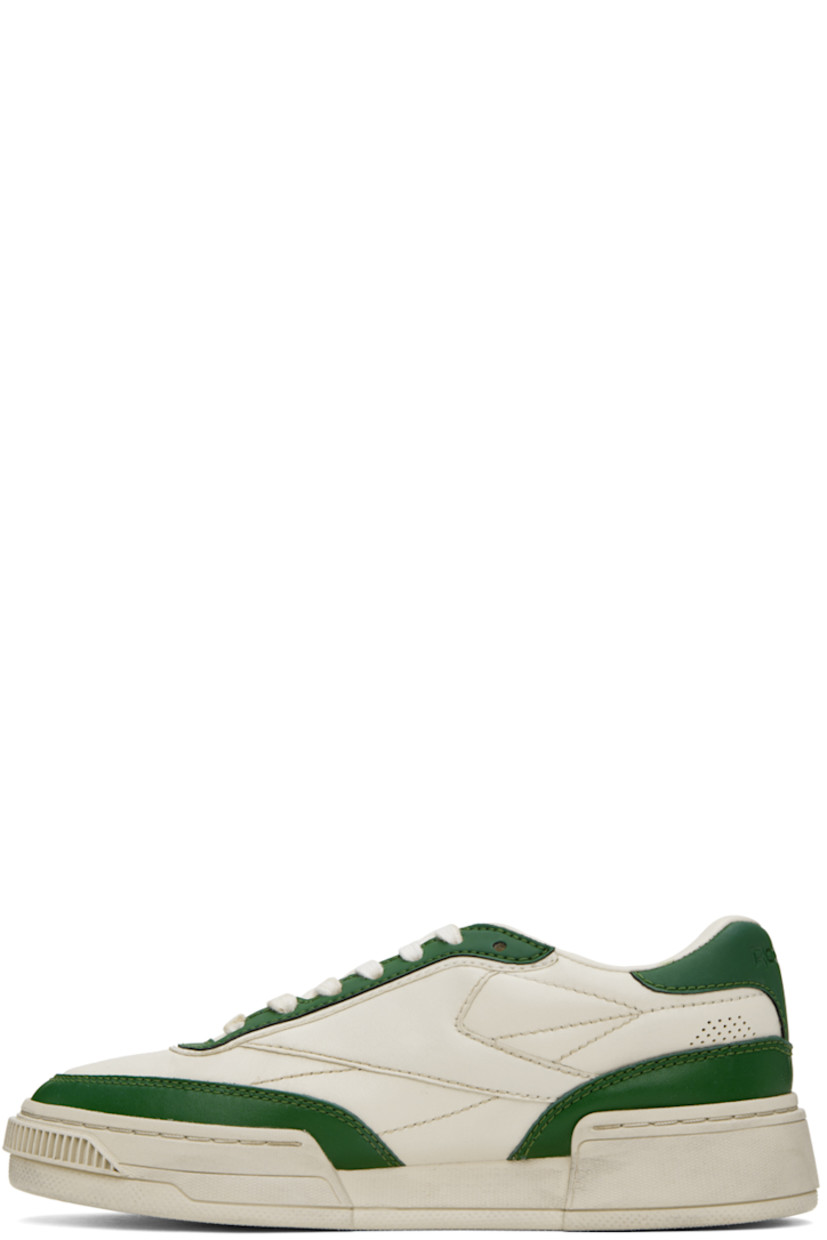 Low-top grained leather sneakers in off-white and green.

· Perforated detailing at toe and sides
· Lace-up closure
· Logo embossed at padded tongue
· Padded collar
· Logo flag at outer side
· Logo embossed at heel counter
· Canvas lining
· EVA foam rubber midsole
· Treaded rubber outsole

Supplier color: Vintage green