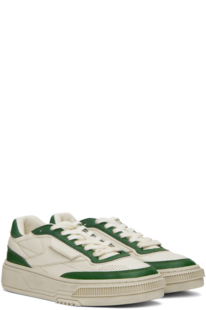 Low-top grained leather sneakers in off-white and green.

· Perforated detailing at toe and sides
· Lace-up closure
· Logo embossed at padded tongue
· Padded collar
�· Logo flag at outer side
· Logo embossed at heel counter
· Canvas lining
· EVA foam rubber midsole
· Treaded rubber outsole

Supplier color: Vintage green