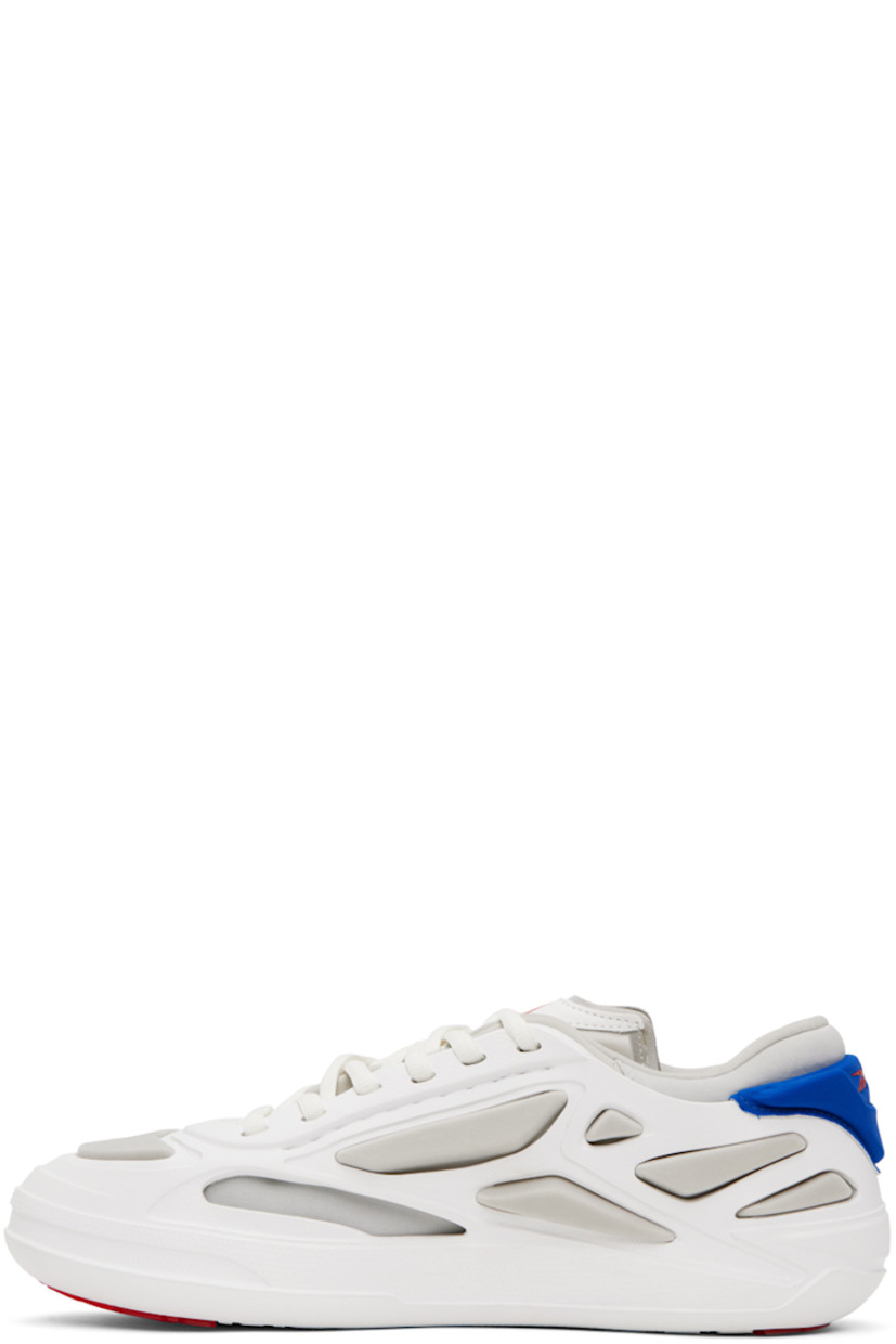 Low-top layered textured rubber and jersey sneakers in white and blue.

· Lace-up closure
· Logo printed at tongue
· Padded collar
· Logo bonded at outer side 
· Logo bonded at heel counter 
· Jersey lining
· Treaded rubber sole

Supplier color: White/Blue