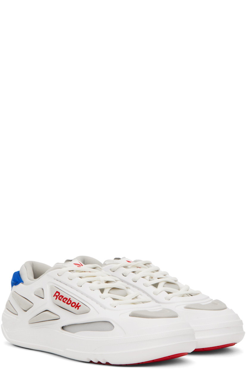 Low-top layered textured rubber and jersey sneakers in white and blue.

· Lace-up closure
· Logo printed at tongue
· Padded collar
· Logo bonded at outer side 
· Logo bonded at heel counter 
· Jersey lining
· Treaded rubber sole

Supplier color: White/Blue