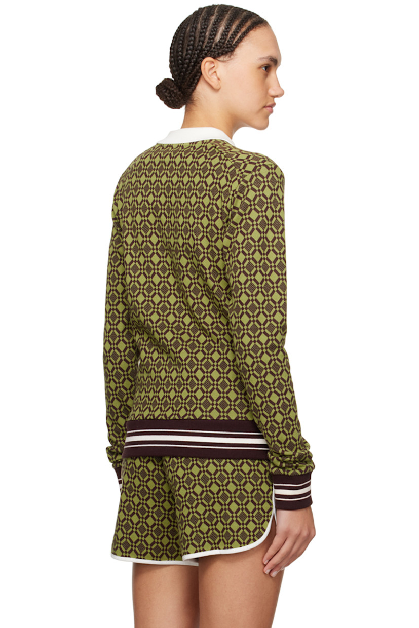 Knit stretch organic cotton polo. Jacquard graphic pattern throughout. 

· Rib knit spread collar
· Three-button placket
· Logo embroidered at chest
· Striped rib knit hem and cuffs

Supplier color: Olive/Dark brown