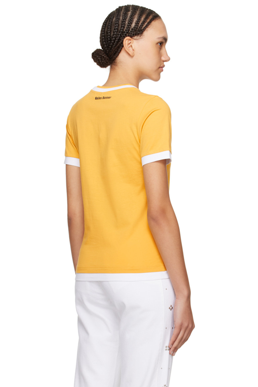 Organic cotton jersey T-shirt. 

· Layered construction
· Crewneck
· Logo embroidered at chest
· Embroidered graphic patch at sleeve
· Logo printed at back collar

Supplier color: Turmeric