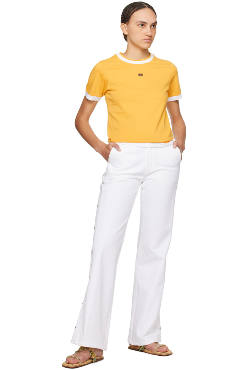 Organic cotton jersey T-shirt. 

· Layered construction
· Crewneck
· Logo embroidered at chest
· Embroidered graphic patch at sleeve
· Logo printed at back collar

Supplier color: Turmeric