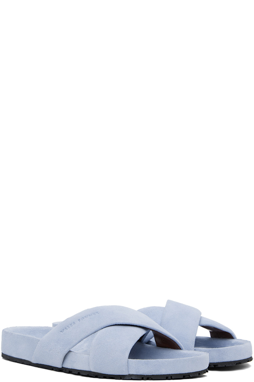 Calfskin suede slip-on flat sandals in blue.

· Open toe
· Logo-embossed padded criss-crossing straps
· Logo stamp at calfskin suede molded footbed
· Treaded rubber sole

Supplier color: Light blue