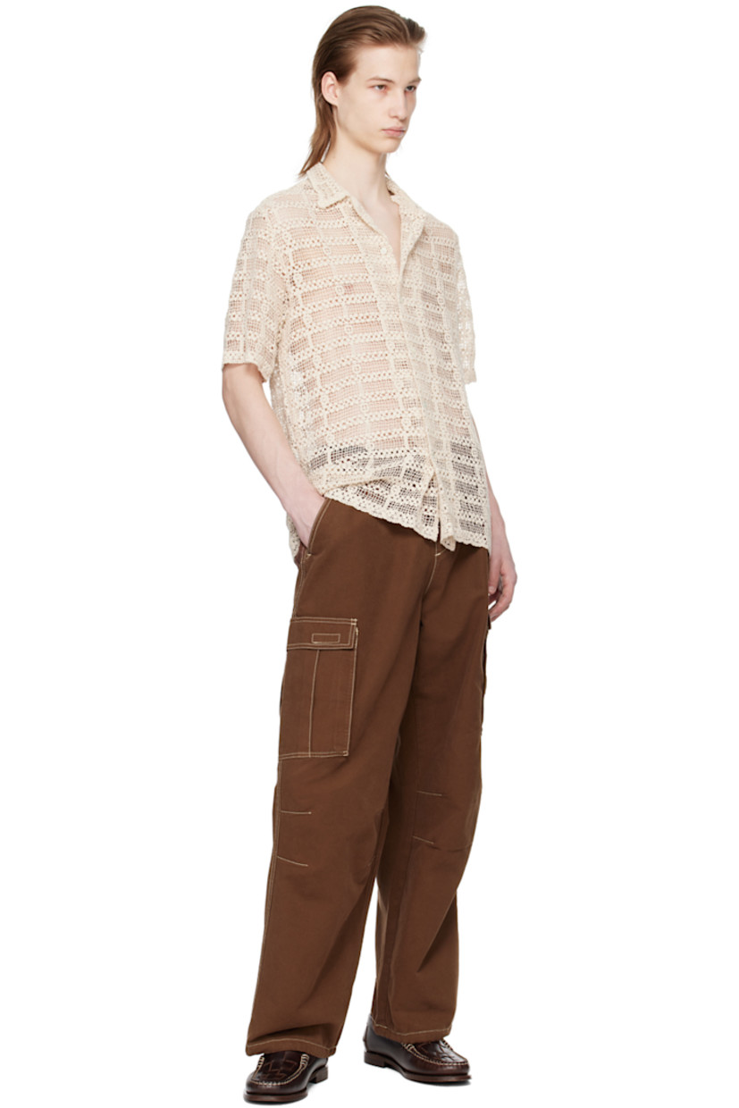 Relaxed-fit cotton twill cargo pants. 

· Concealed drawstring at elasticized waistband
· Three-pocket styling 
· Drawstring at hem 
· Flap pocket at outseams 
· Contrast topstitching in off-white 

Supplier color: Washed brown