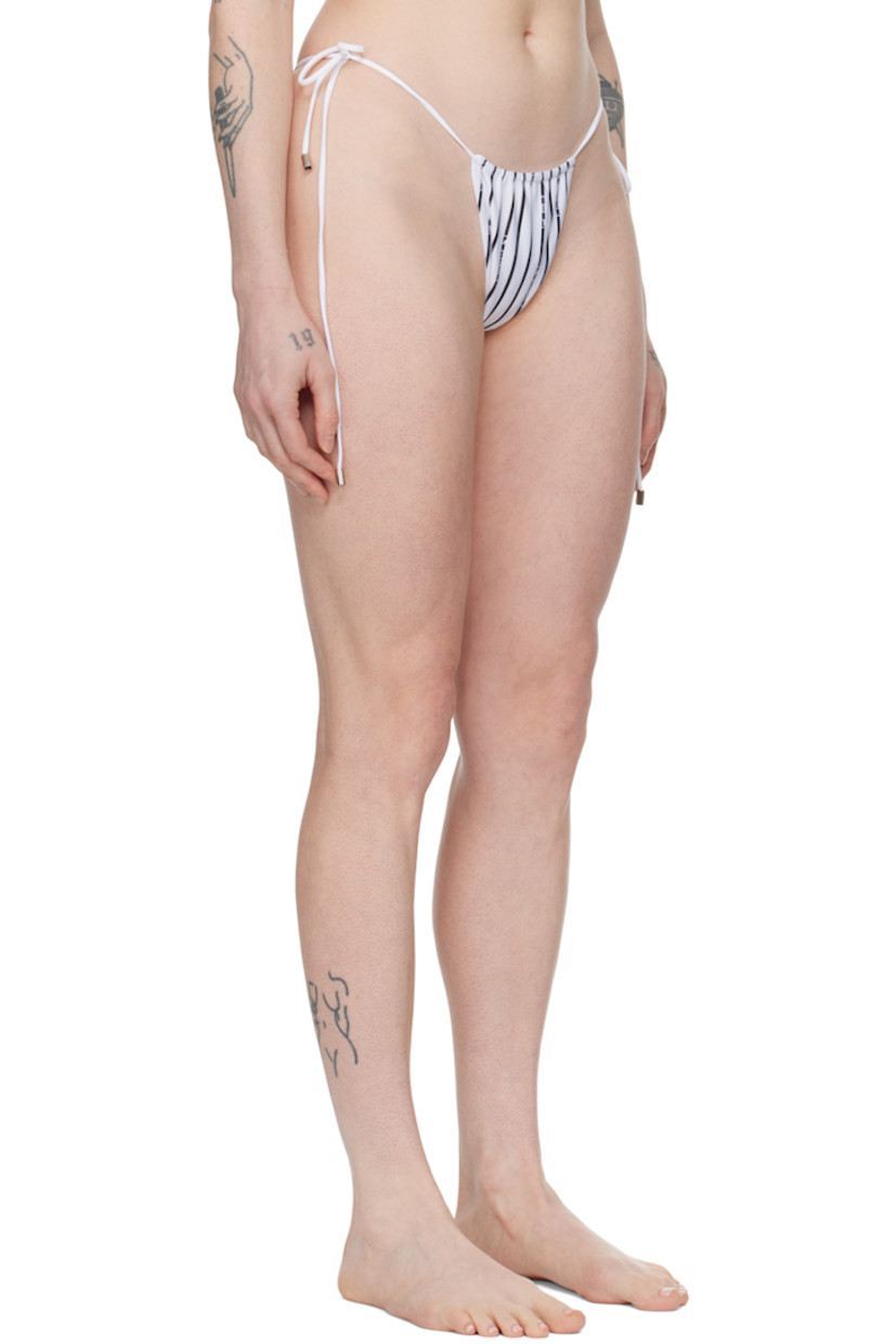 Reversible stretch recycled polyester jersey bikini bottom. Stripes and logos printed throughout.

Reverse in white stretch recycled polyester jersey.

· Self-tie fastening at sides
· Fully lined 

Supplier color: White/Black