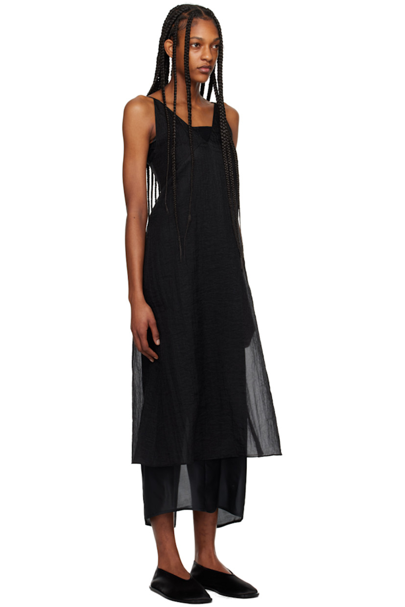 Semi-sheer crinkled polyester organza dress.

· V-neck
· Seam pockets
· Elasticized strap at back
· Zip closure at back
· Central vent at back hem

Supplier color: Black