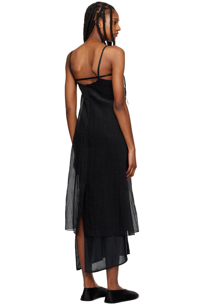 Semi-sheer crinkled polyester organza dress.

· V-neck
· Seam pockets
· Elasticized strap at back
· Zip closure at back
· Central vent at back hem

Supplier color: Black