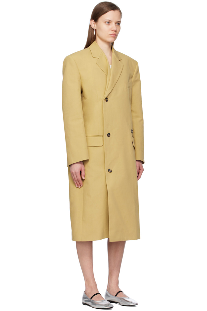 Plain-woven cotton coat.

· Notched lapel
· Folded double-breasted button closure
· Welt pocket and flap pockets
· Padded shoulders
· Vented cuffs
· Central vent at back hem
· Full Bemberg cupro-blend satin lining 

Supplier color: Khaki beige