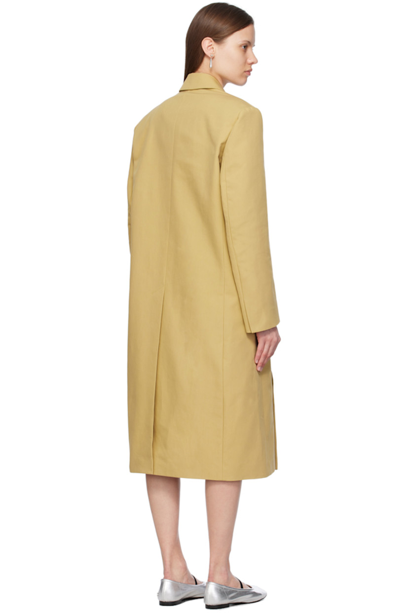 Plain-woven cotton coat.

· Notched lapel
· Folded double-breasted button closure
· Welt pocket and flap pockets
· Padded shoulders
· Vented cuffs
· Central vent at back hem
· Full Bemberg cupro-blend satin lining 

Supplier color: Khaki beige