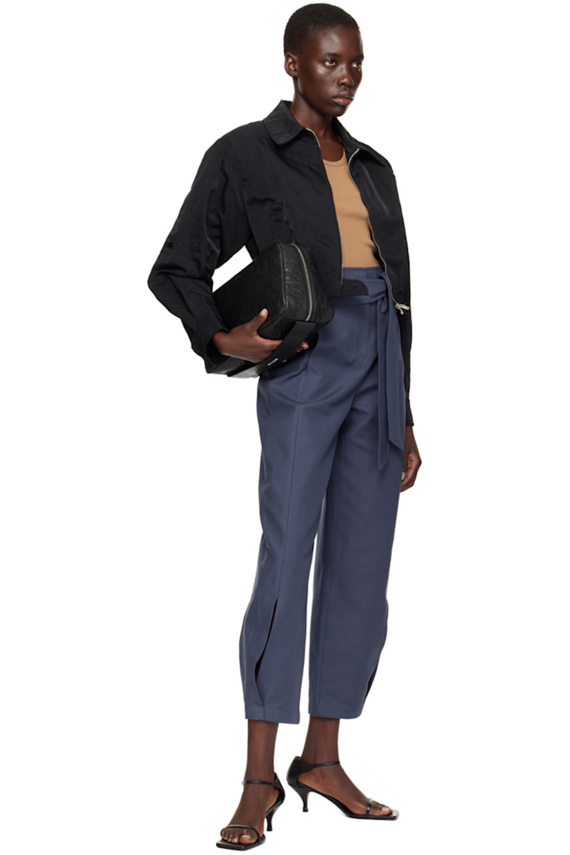 Crinkled nylon canvas jacket.

· Spread collar
· Zip closure
· Welt pockets
· Elasticized cropped hem
· Padded dropped shoulders
· Single-button barrel cuffs
· Full twill lining

Supplier color: Black